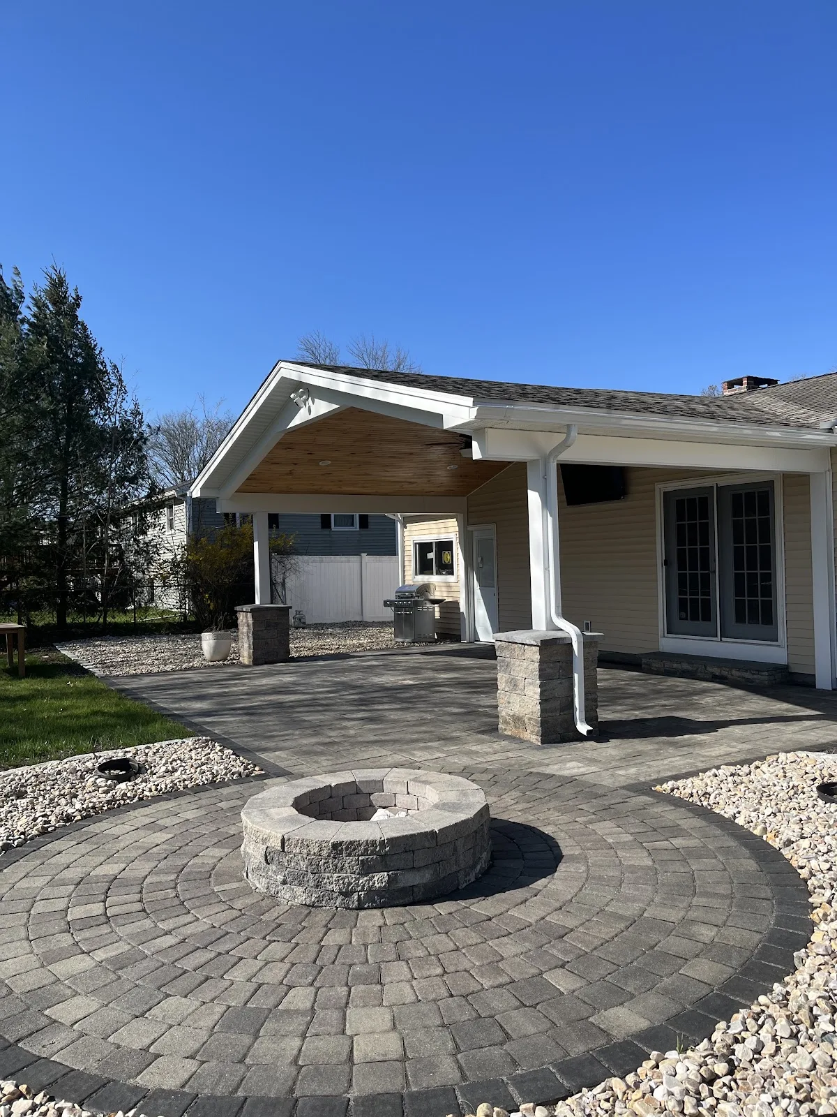 Circular paver fire pit patio repaired by CleanScapes in Northwest Connecticut