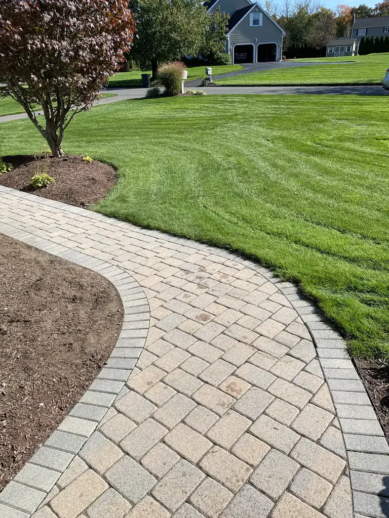 Cobble walkway, East Windsor Cobble paver walkway with a soldier border sweeping across a front lawn in East Windsor, CT