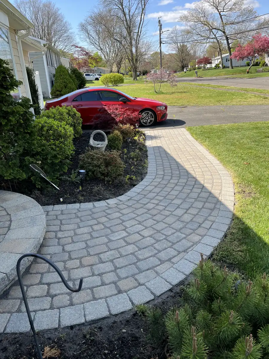 Walkway and round landing Cobble paver walkway and round front landing after joint sand replacement in Southington, CT