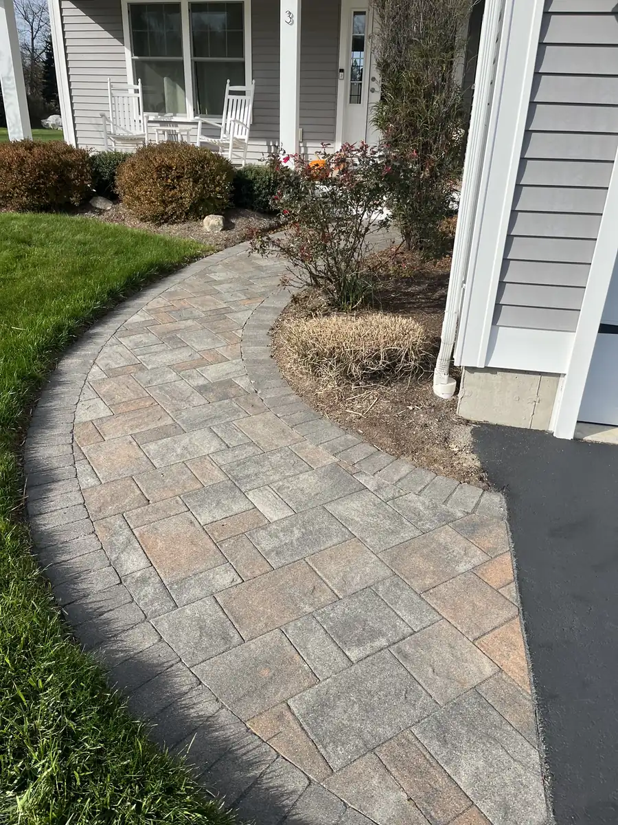 Curved paver walkway with a border leading to a front porch, cleaned in Columbia, CT
