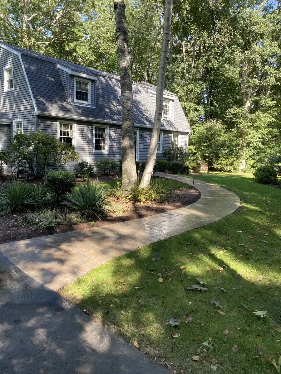 Front walk, Farmington Curving front walkway through shade gardens to a gambrel colonial home in Farmington, CT