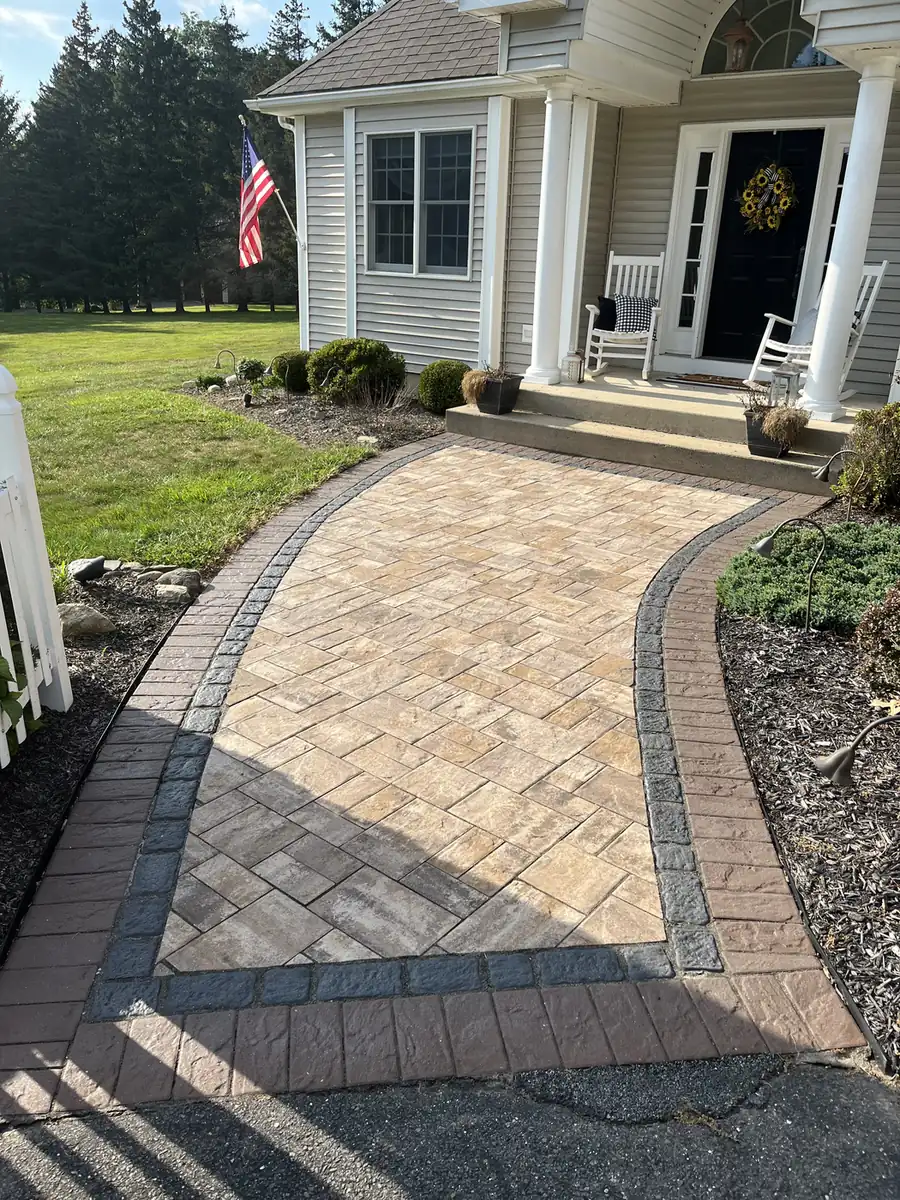 Herringbone paver front walk with a double border at a porch with rocking chairs in Burlington, CT