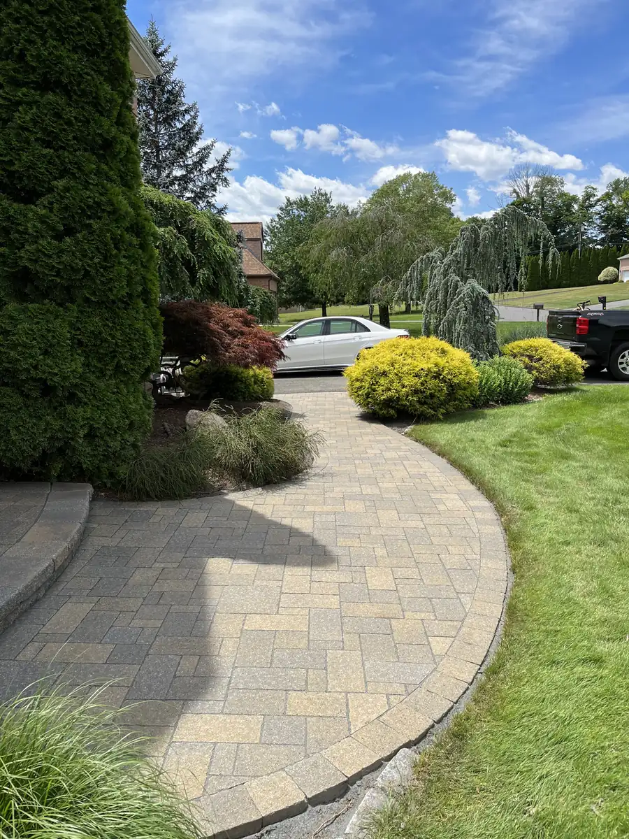 Entry walk, Rocky Hill Paver entry walk with a rounded step landing, cleaned and sealed at a brick home in Rocky Hill, CT