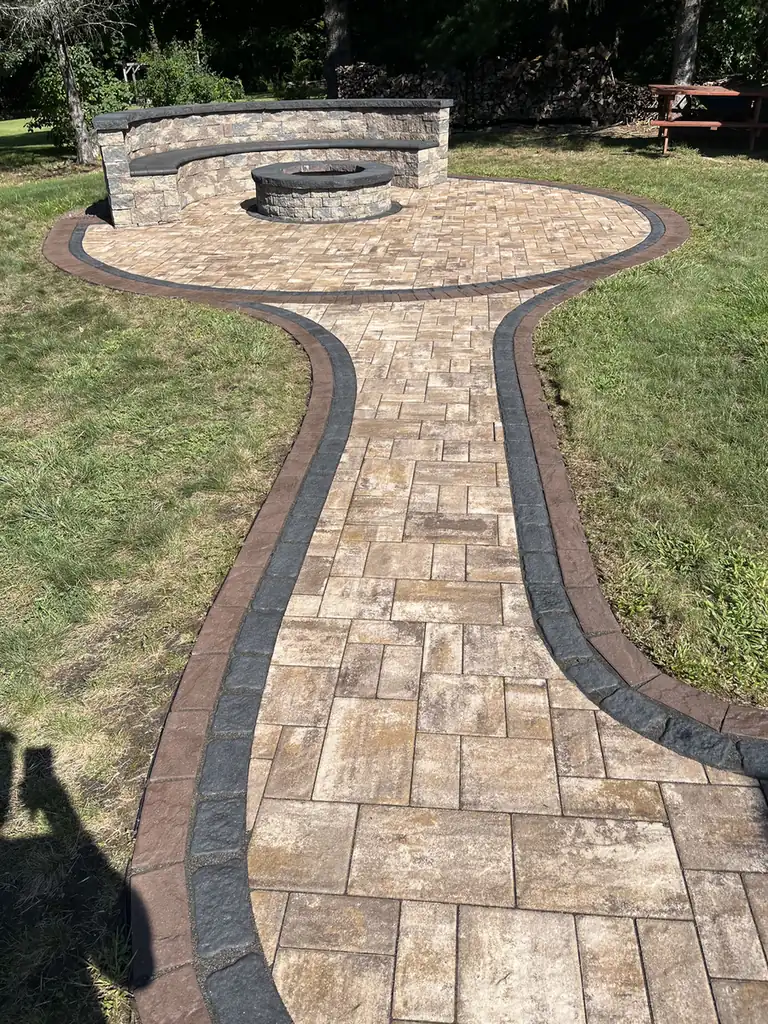 Path to fire pit, Burlington Paver path with a double border leading to a round fire pit patio and seat wall in Burlington, CT