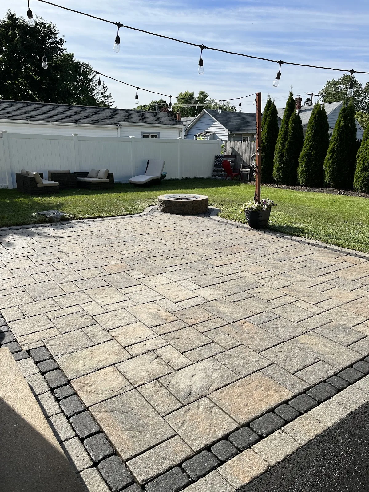 Restored paver patio with reset stones after repair work in Northwest Connecticut