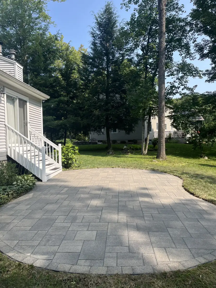 Rounded patio, Farmington Rounded paver patio cleaned and re-sanded behind a colonial home in Farmington, CT