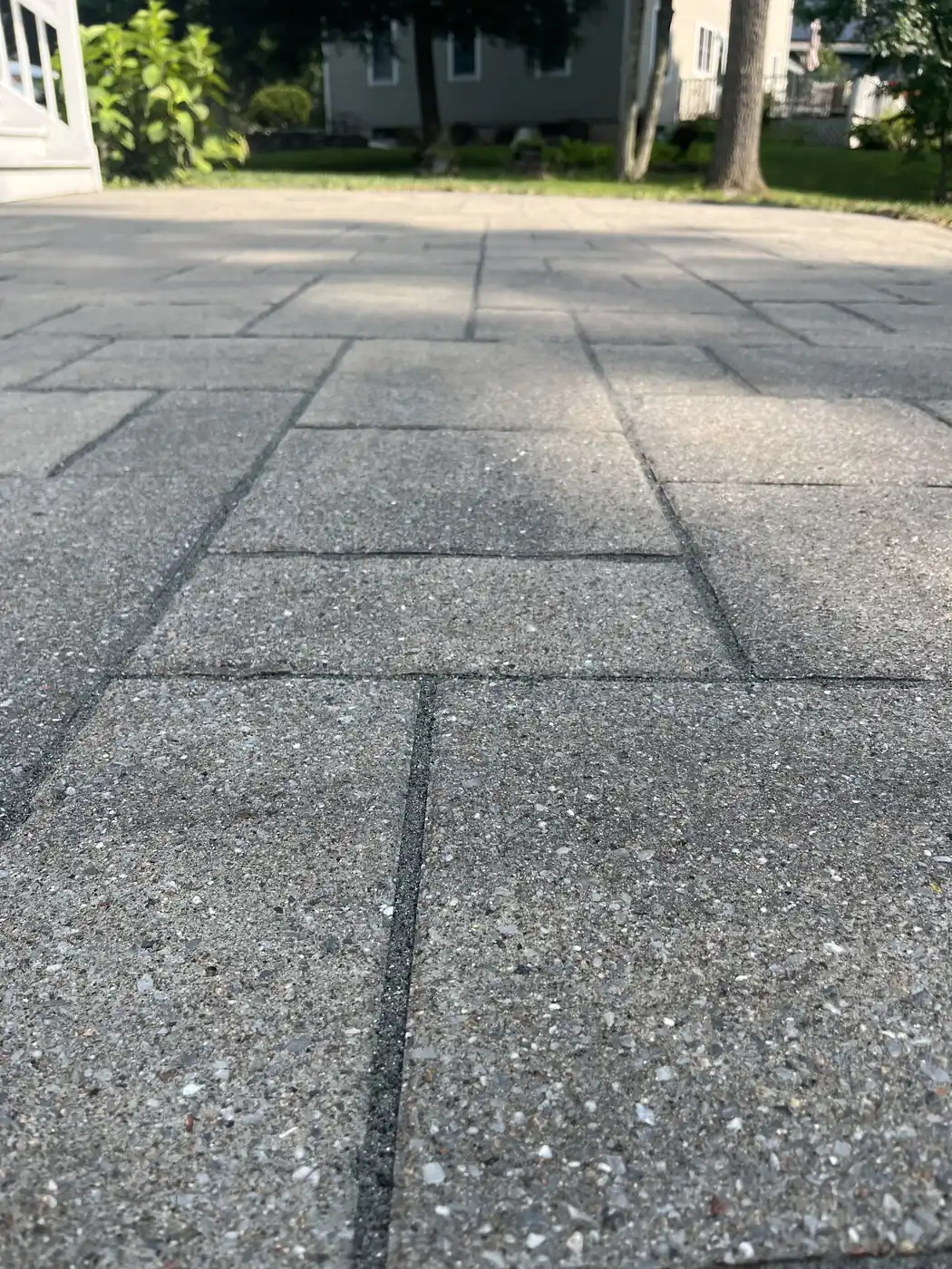 Freshly sanded joints Close-up of large slab pavers with tight, freshly sanded joints on a patio in Farmington, CT
