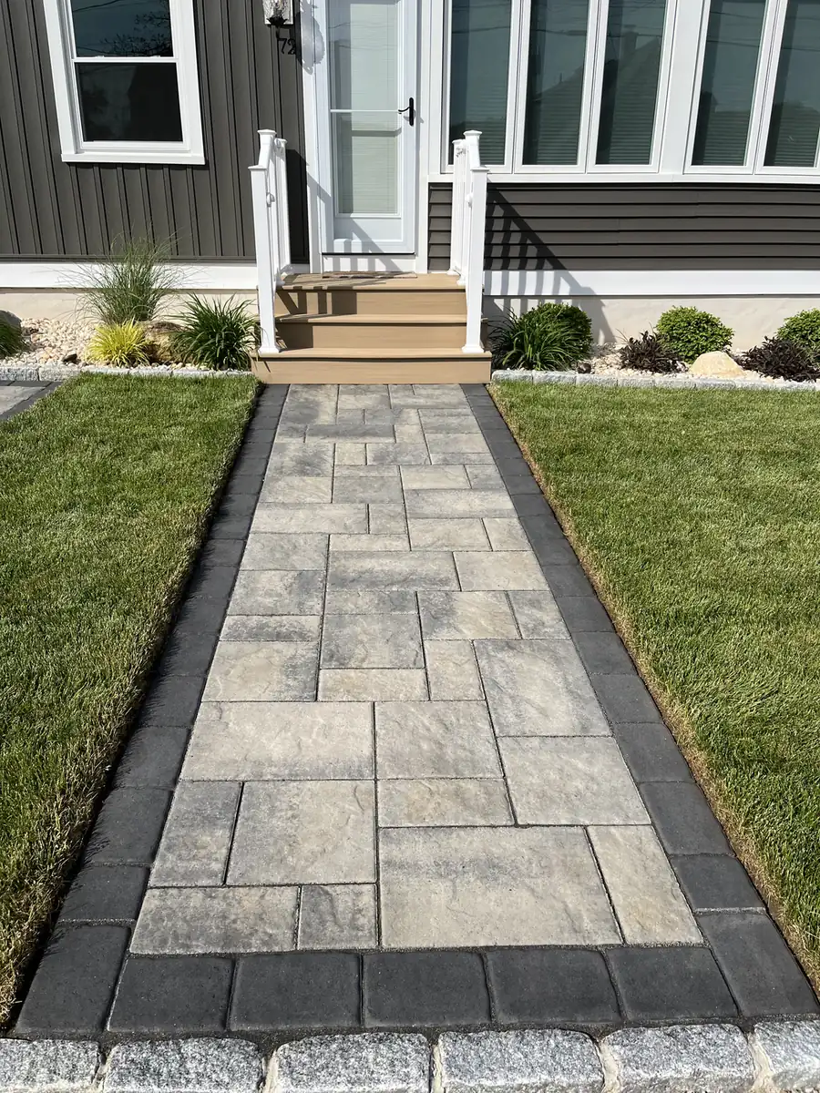 Large-format slab paver walkway with a charcoal border leading to front steps in Old Lyme, CT