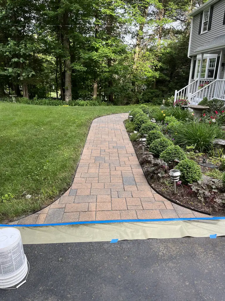 Masked walkway, Avon Paver walkway masked with tape and paper at the driveway apron ahead of sealing in Avon, CT